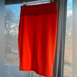 I’m in love with Derek hot orange pencil skit with opening in the back. Size L